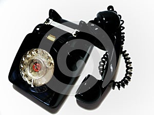 A vintage and antique telephone with white background. photo